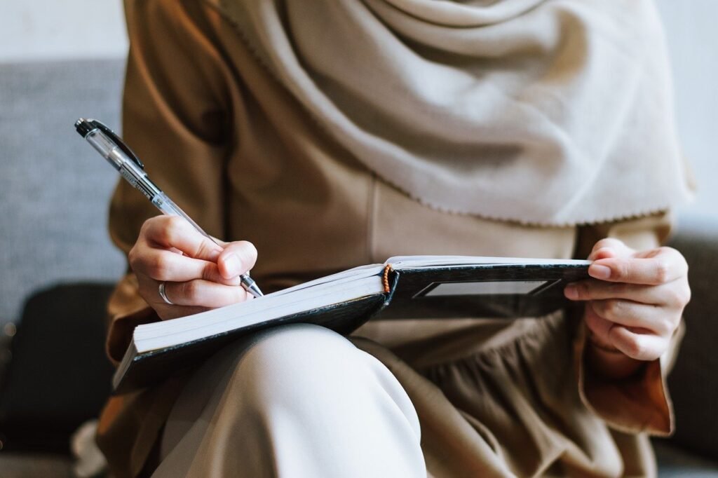 One individual planning a startup plan on her notebook